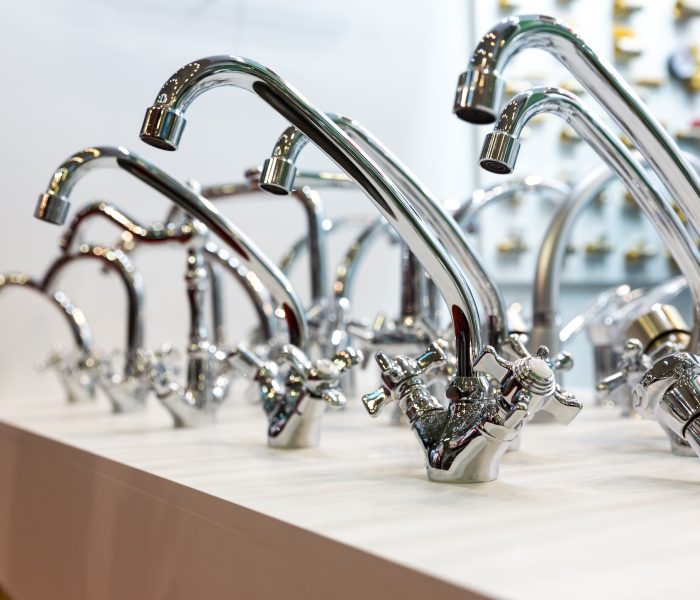 Kitchen faucets on shelf closeup, plumbing shop Kitchen faucets on shelf closeup, plumbing shop